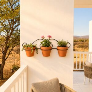 Sunlit Balcony Herb Garden with Wrought Iron Potholder