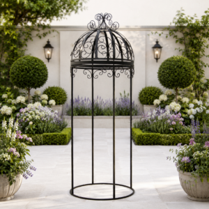 Wrought iron German pergola in a symmetrical South African garden.