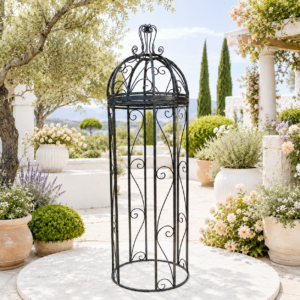 Wrought iron pergola on sunny mediterranean garden terrace.