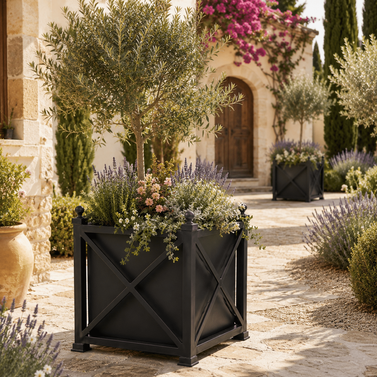 Sunlit Mediterranean courtyard with lush greenery in Classic steel flower pot